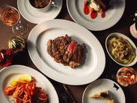 A special Christmas dinner at an authentic New York steakhouse featuring 6 dishes including a 21-day aged Black Angus beef rib steak