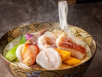 Lunch set (weekdays only) — Cantonese-style pho: seafood and Yatsugatake malt‑fed red chicken in a rich broth. From 9/1