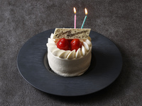 Celebrate with anniversary cake + commemorative photo + champagne toast