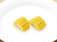 Two single ears of corn
