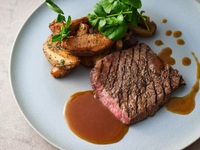 Grilled Kameoka beef with gravy sauce flavored with lemons from Ishiwari Farm (served with soup, salad, bread, and coffee or tea)